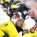 Michigan senior quarterback Denard Robinson attempts to find a hole as he runs the ball in the third quarter of the Outback Bowl at Raymond James Stadium of the in Tampa, Fla. on Tuesday, Jan. 1. Melanie Maxwell I AnnArbor.com